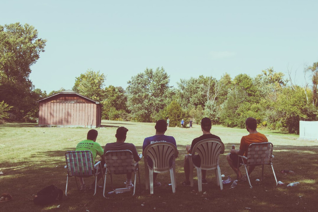 Group of friends sitting together outdoors