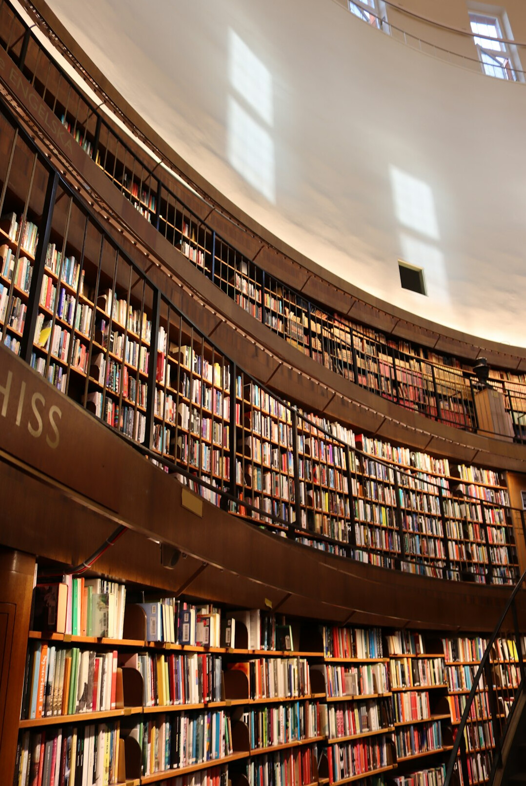 Library reading room with tall bookshelves