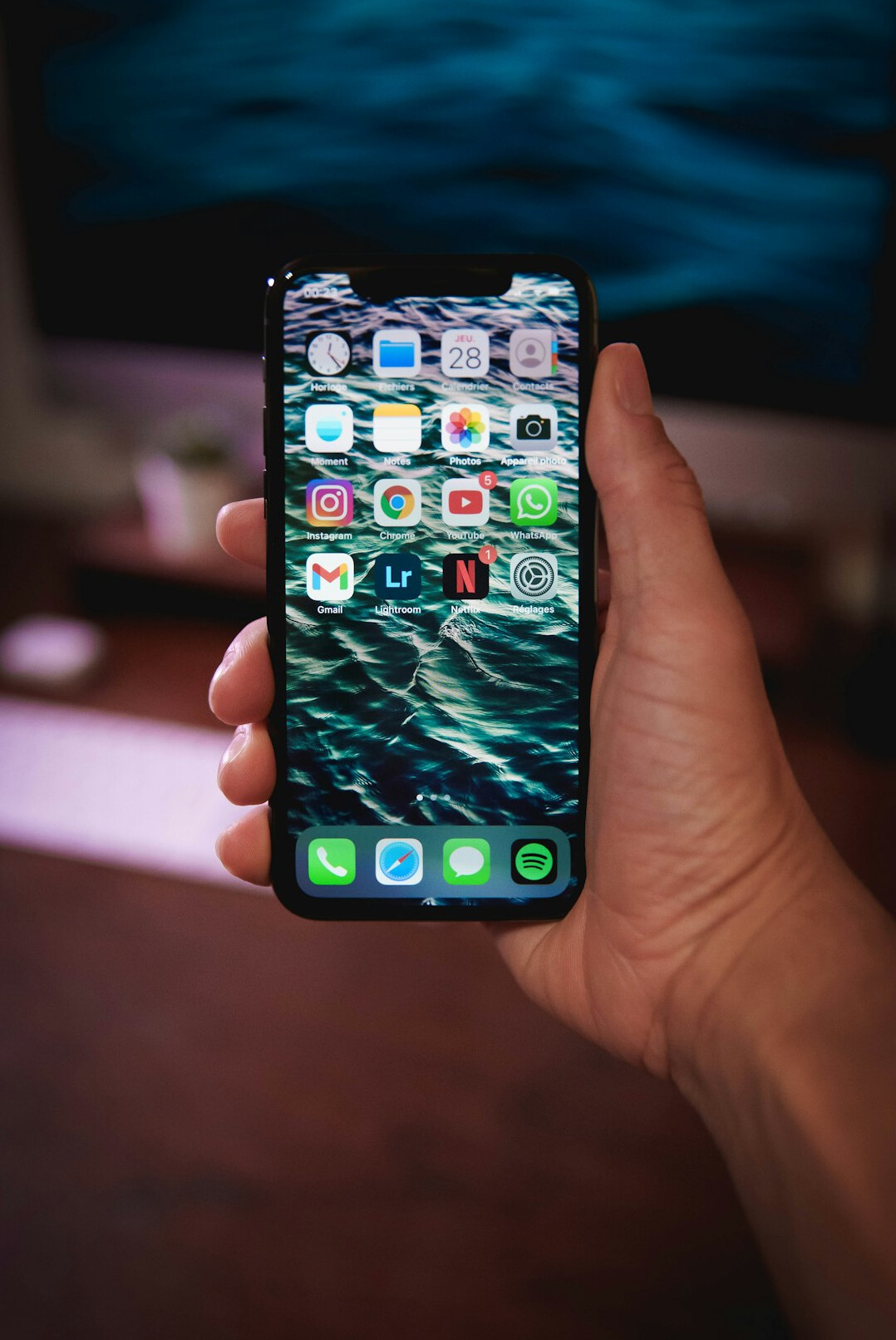 Smartphone showing a social app on a desk